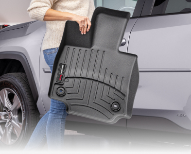 woman holding floor liner